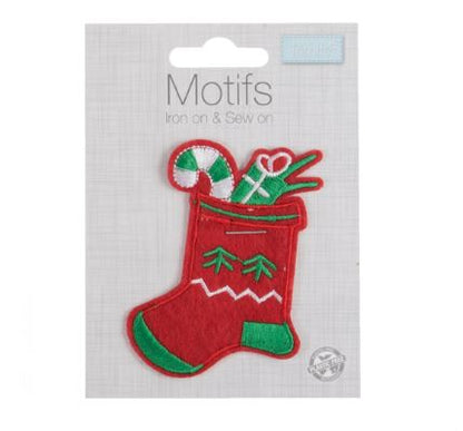 A red and green Christmas stocking embroidered motif filled with gifts